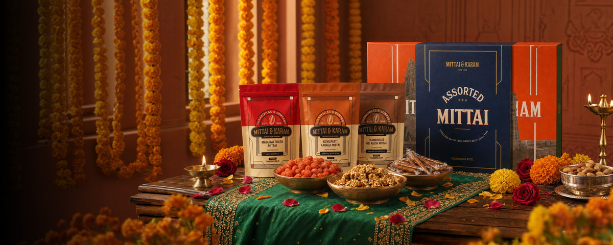 Mittai & Karams signature gift boxes and pouches on a festive table